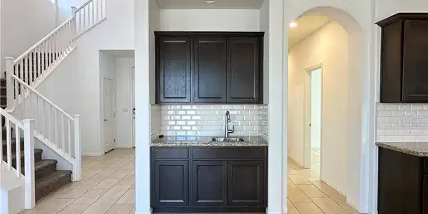 Image 3: A well-appointed culinary space featuring sleek ap