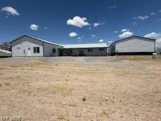 Image 3: A sprawling single-story residence with an accompa