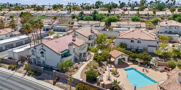 Image 2: Spanish tile roofs and a sparkling swimming pool d