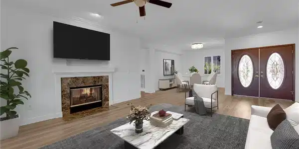 Image 3: Hardwood floors and a classic fireplace anchor thi