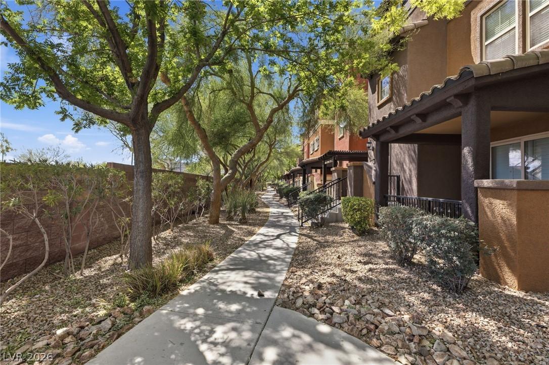 Image 3: This inviting walkway leads to charming residences
