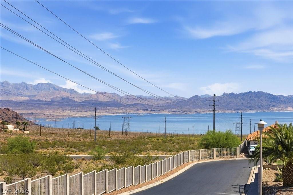 Image 2: Panoramic lake and mountain views define this capt