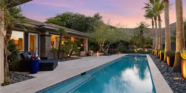 Image 2: Mature trees and desert-friendly landscaping adorn