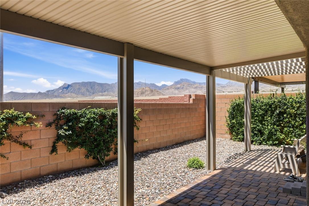 Image 3: A spacious covered patio provides a shaded retreat