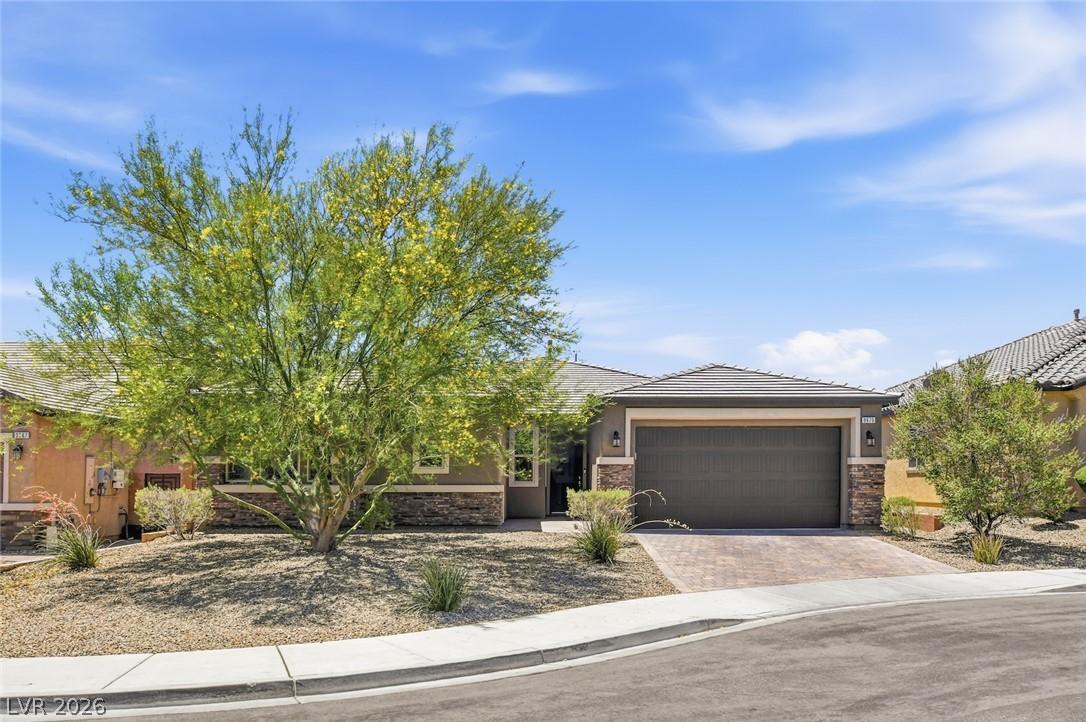 Image 4: A desert-friendly landscape surrounds this residen