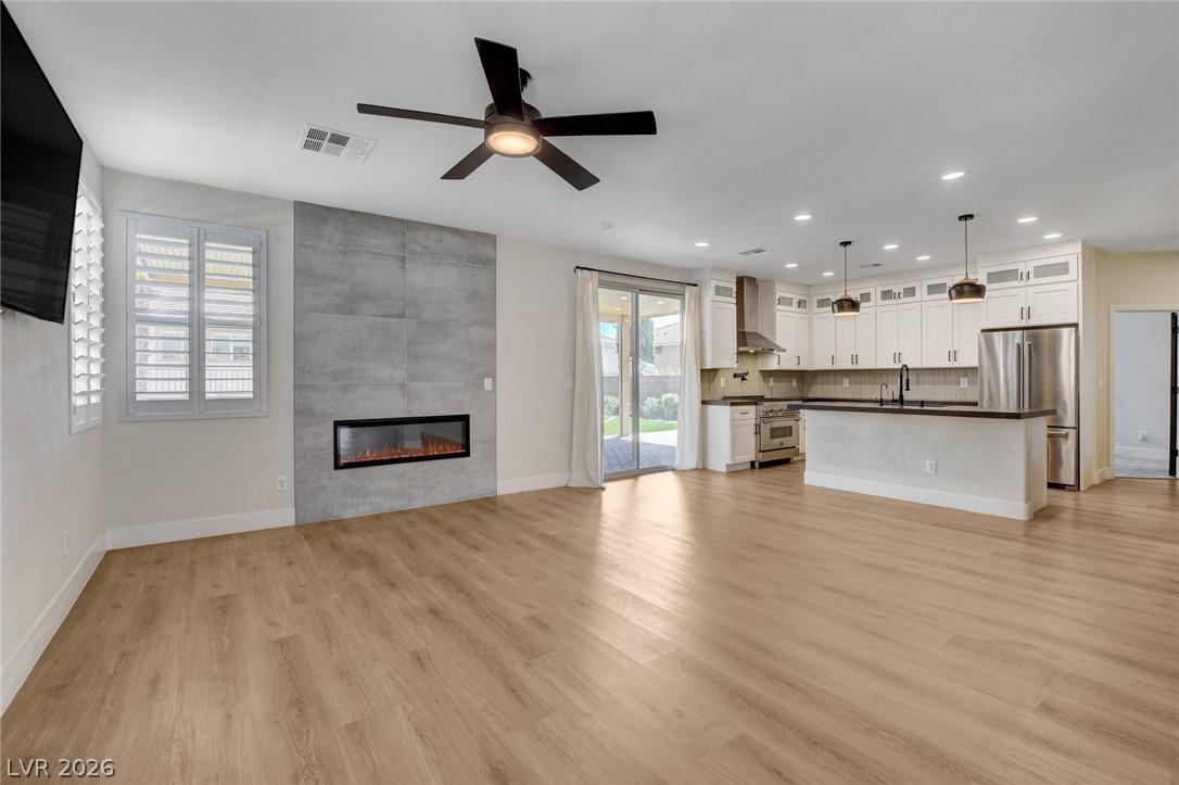Image 2: An open-concept living area with a sleek linear fi