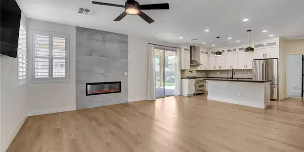 Image 2: An open-concept living area with a sleek linear fi