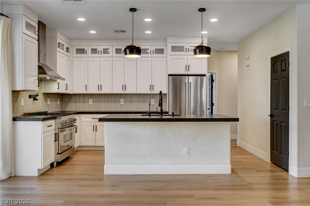 Image 3: A well-appointed culinary space featuring sleek wh