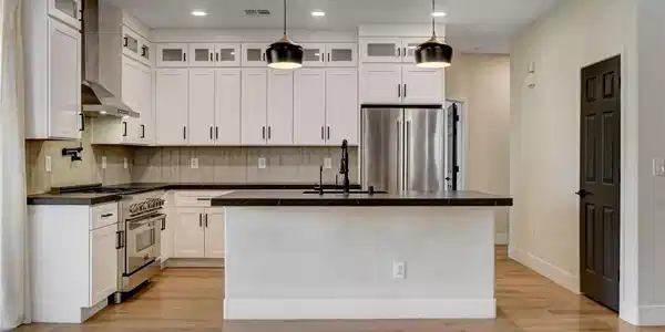 Image 3: A well-appointed culinary space featuring sleek wh