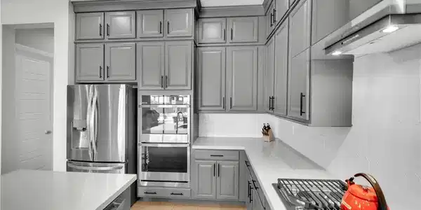 Image 4: Streamlined cabinetry and sleek stone countertops