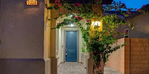 Image 4: A charming entrance with climbing flora and a welc
