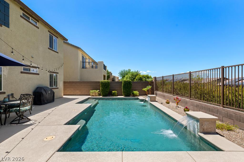 Image 3: A private swimming oasis with flowing water featur