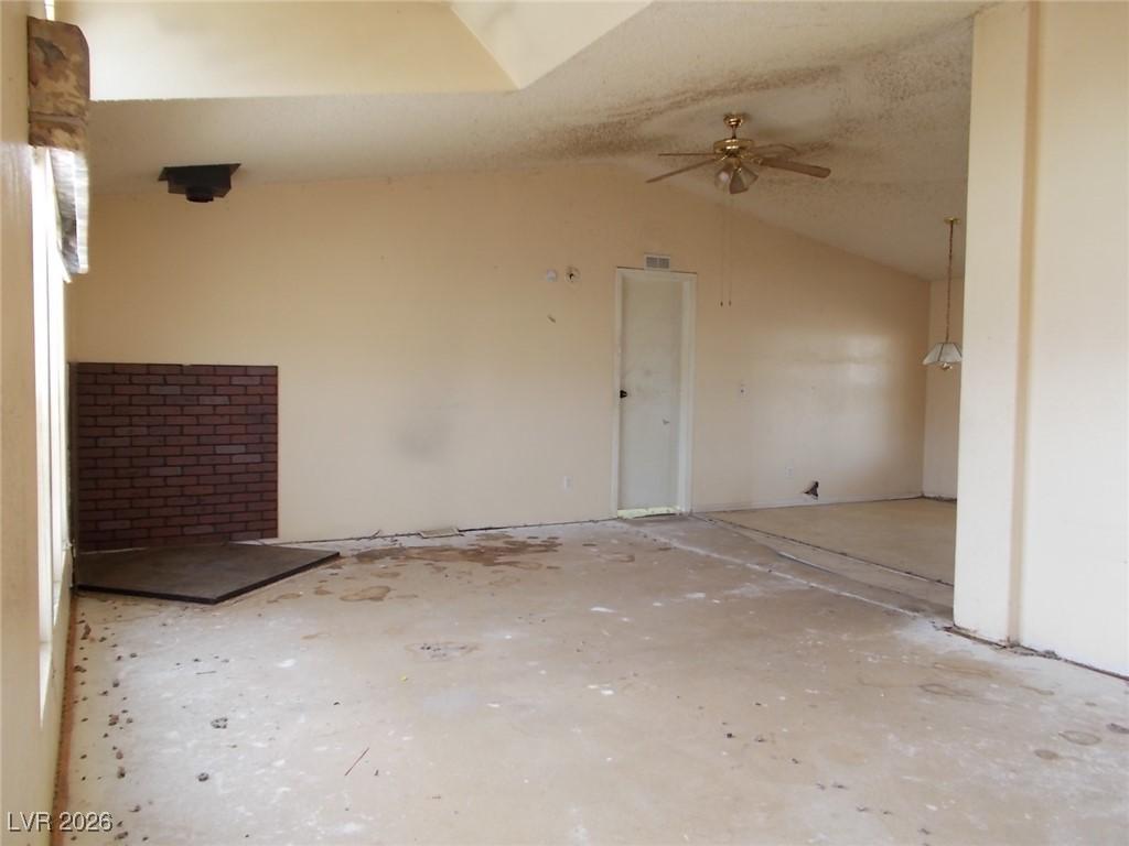 Image 3: Empty room with vaulted ceiling and ceiling fan
