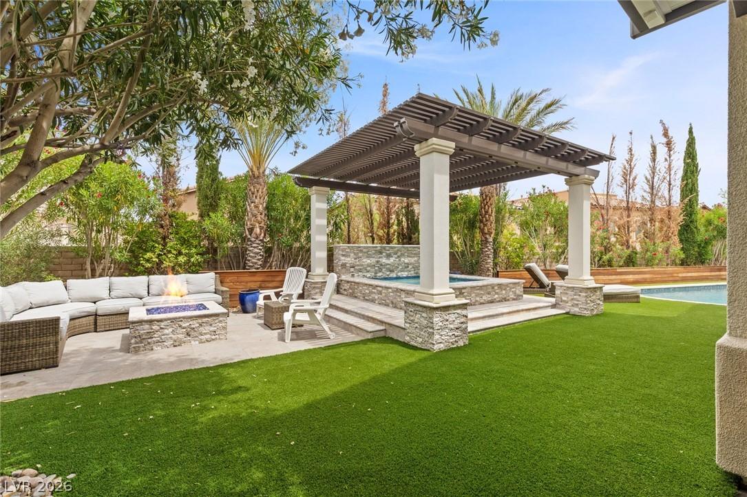 Image 2: A private outdoor haven features a cozy fire pit,