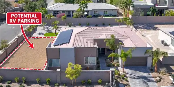 Image 2: Solar panels line the roof of this contemporary si