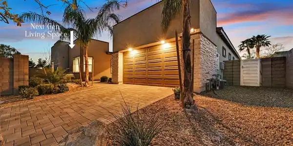Image 3: Modern architecture defines this sleek exterior fe