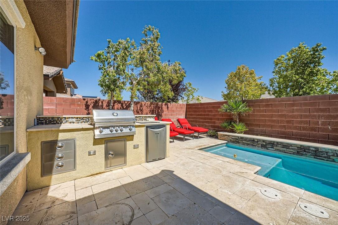 Image 2: View of patio / terrace with a grill, area for gri