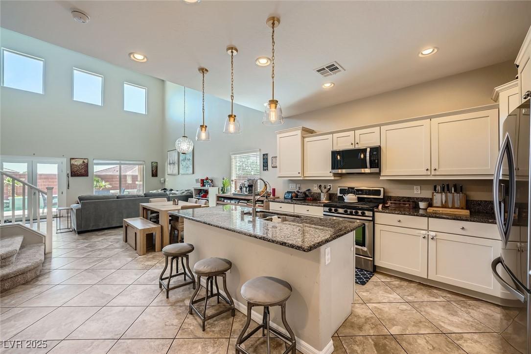 Image 3: Kitchen with appliances with stainless steel finis