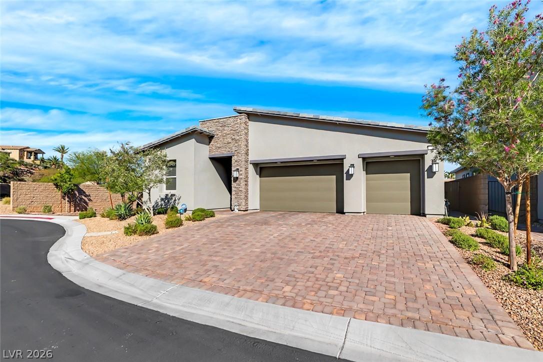 Image 2: A contemporary residence showcasing a paver drivew
