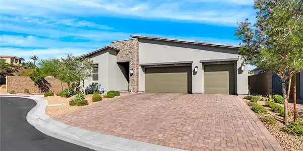 Image 2: A contemporary residence showcasing a paver drivew