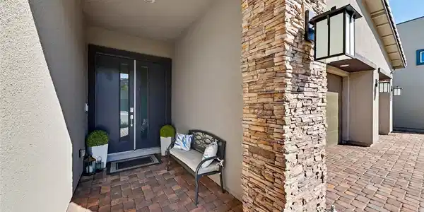 Image 3: A welcoming front entrance featuring dark double d