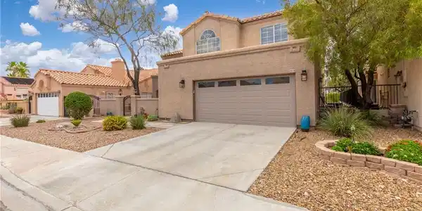 Image 2: 2 car garage w/ door to the outside.