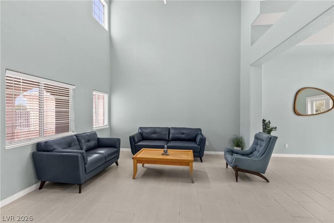 Image 4: Natural light floods this airy living space with s