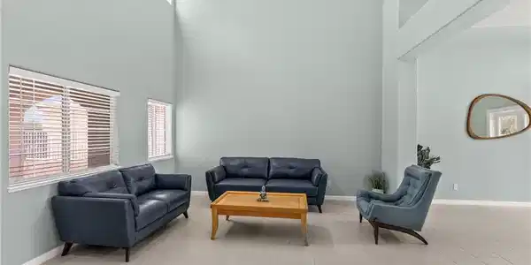 Image 4: Natural light floods this airy living space with s