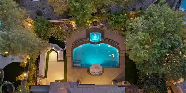 Image 4: Aerial view of the backyard pool and spa retreat.