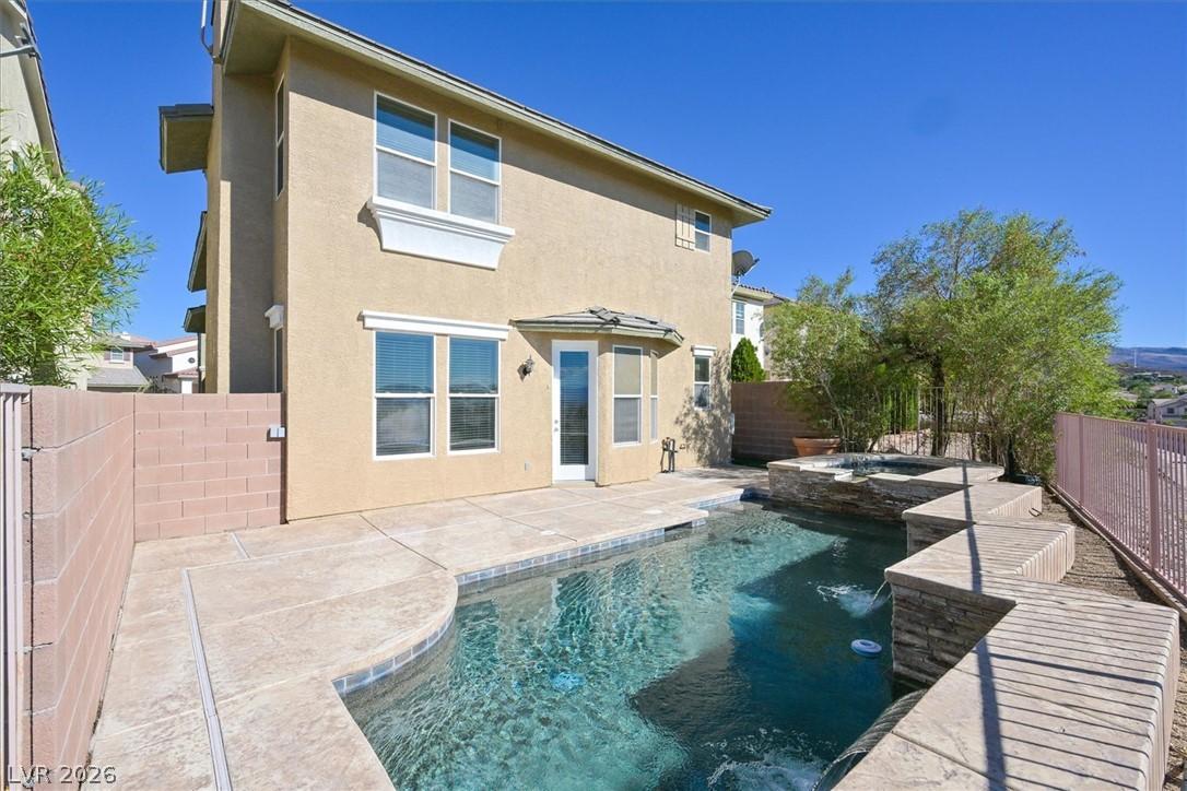 Image 3: A tranquil backyard oasis featuring a pristine poo