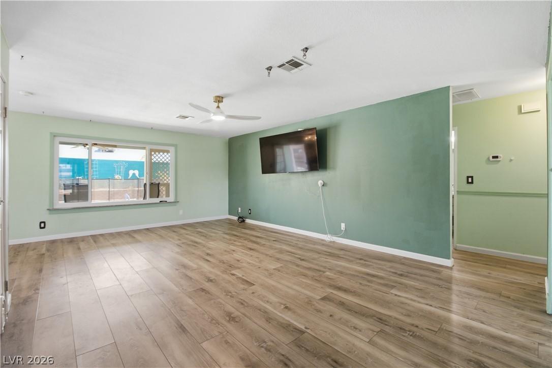 Image 4: A spacious room offers comfortable living with dur