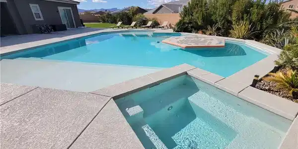 Image 3: An inviting private pool and spa offers luxurious