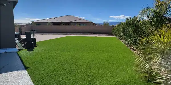 Image 4: Green, low-maintenance turf defines this tranquil