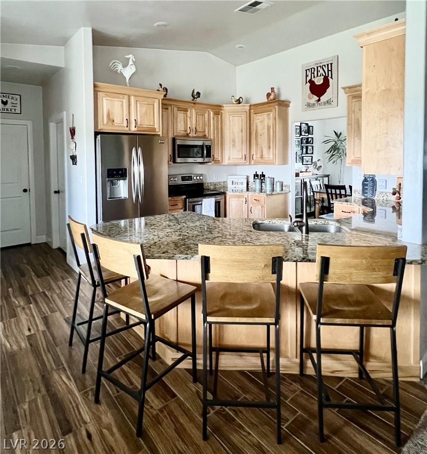 Image 3: A well-appointed culinary space featuring light wo