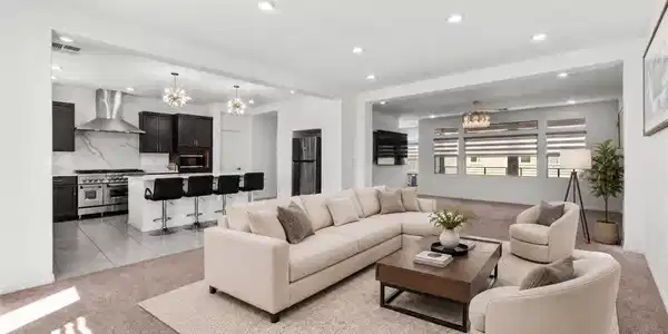 Image 4: Recessed lighting and an open floor plan connect t