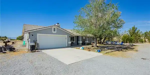 Image 2: Ranch-style home with concrete driveway, an attach