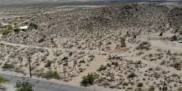 Image 2: View of rural area featuring a desert landscape an