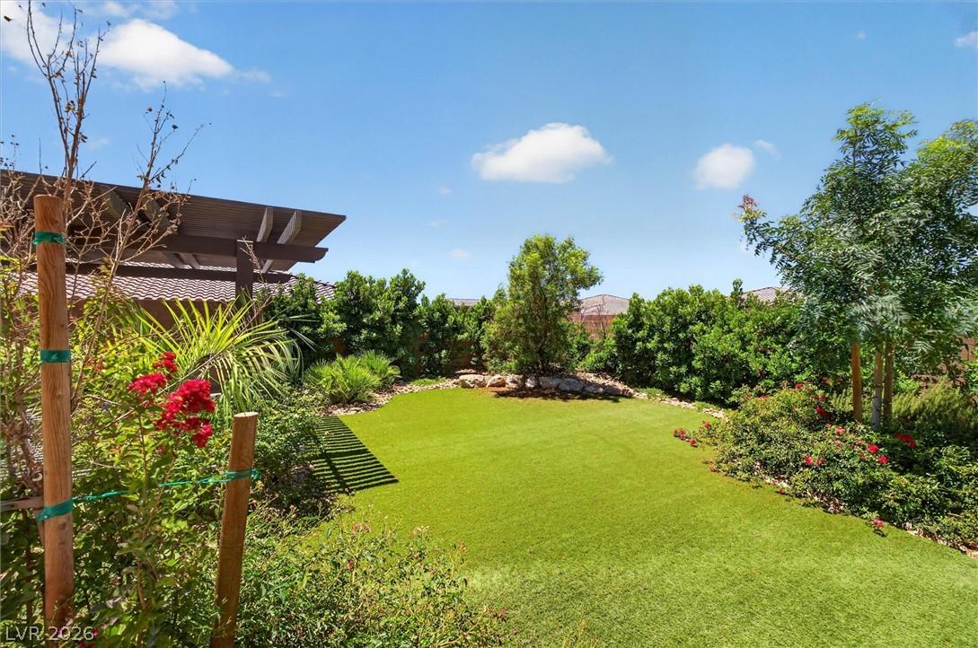 Image 3: A private yard with vibrant plantings, manicured g