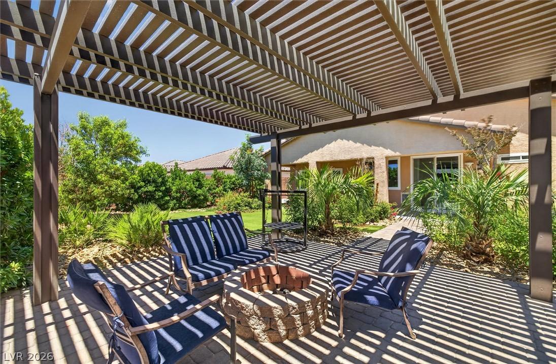 Image 4: An inviting outdoor retreat, featuring a fire pit