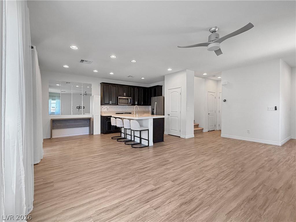 Image 4: An open-concept living space integrates a modern k