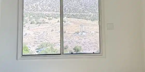 Image 4: A desert vista unfolds through a generously sized