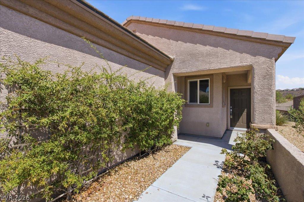 Image 3: A well-maintained stucco facade welcomes you to th
