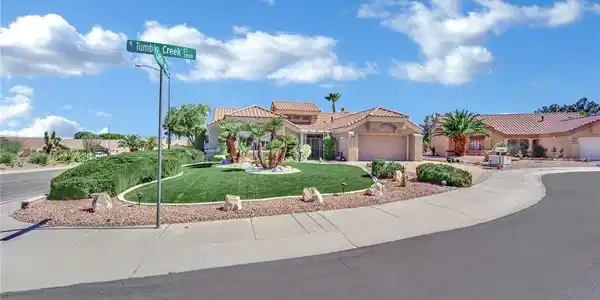 Image 4: A beautifully landscaped corner lot features a Spa