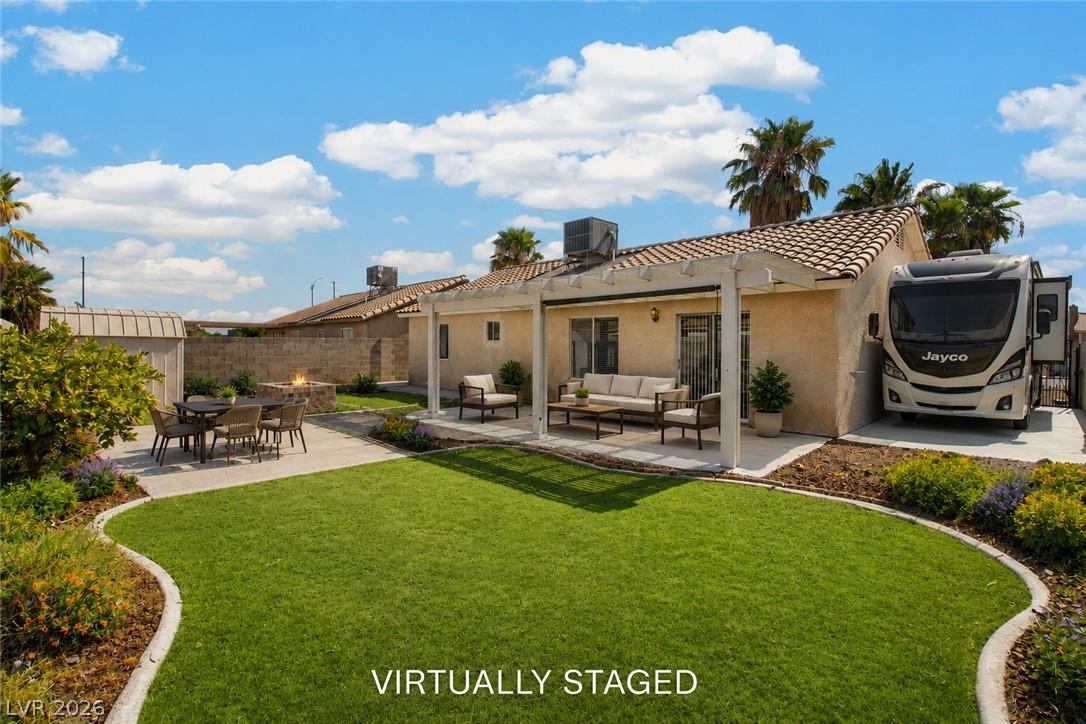 Image 2: Virtually Staged. Private backyard features a cove