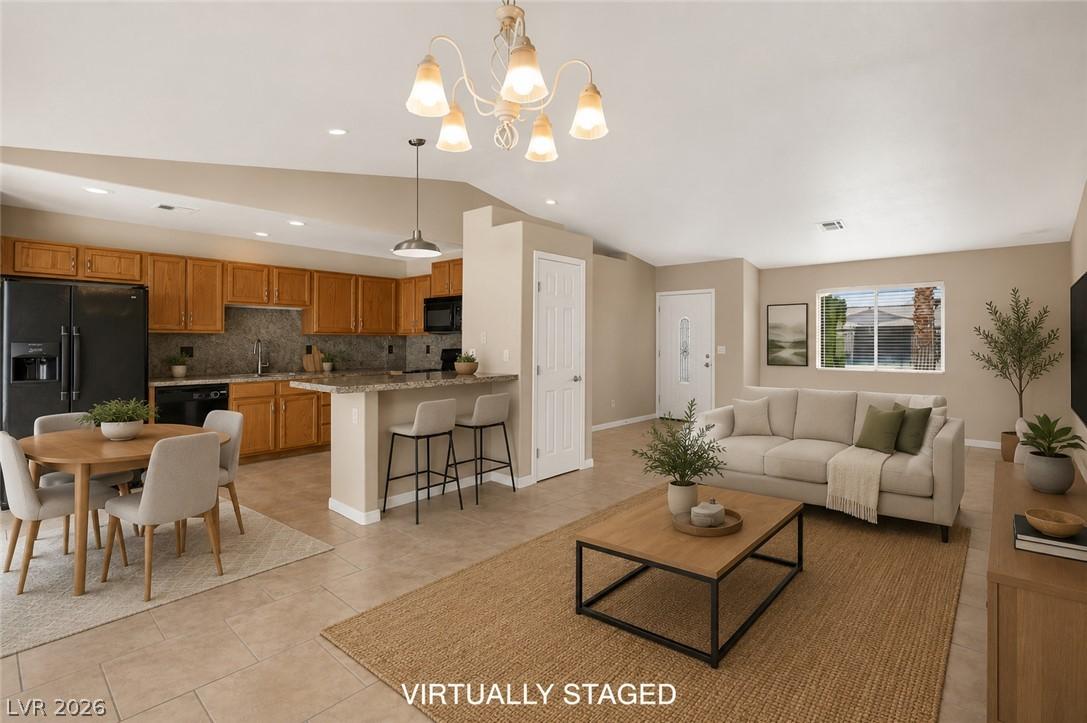 Image 3: Virtually Staged. Open-concept layout seamlessly c
