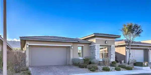 Image 3: Clean lines and stone accents define this modern s