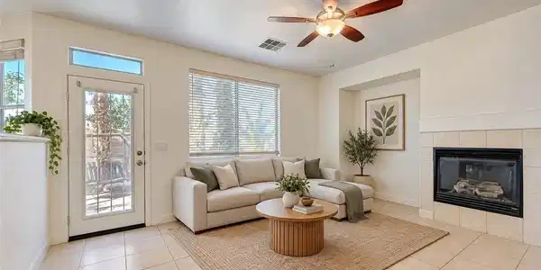 Image 4: An inviting tiled living area centers around a cla