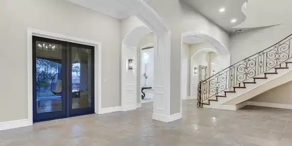Image 4: Family room featuring stone tile floors, beamed ce