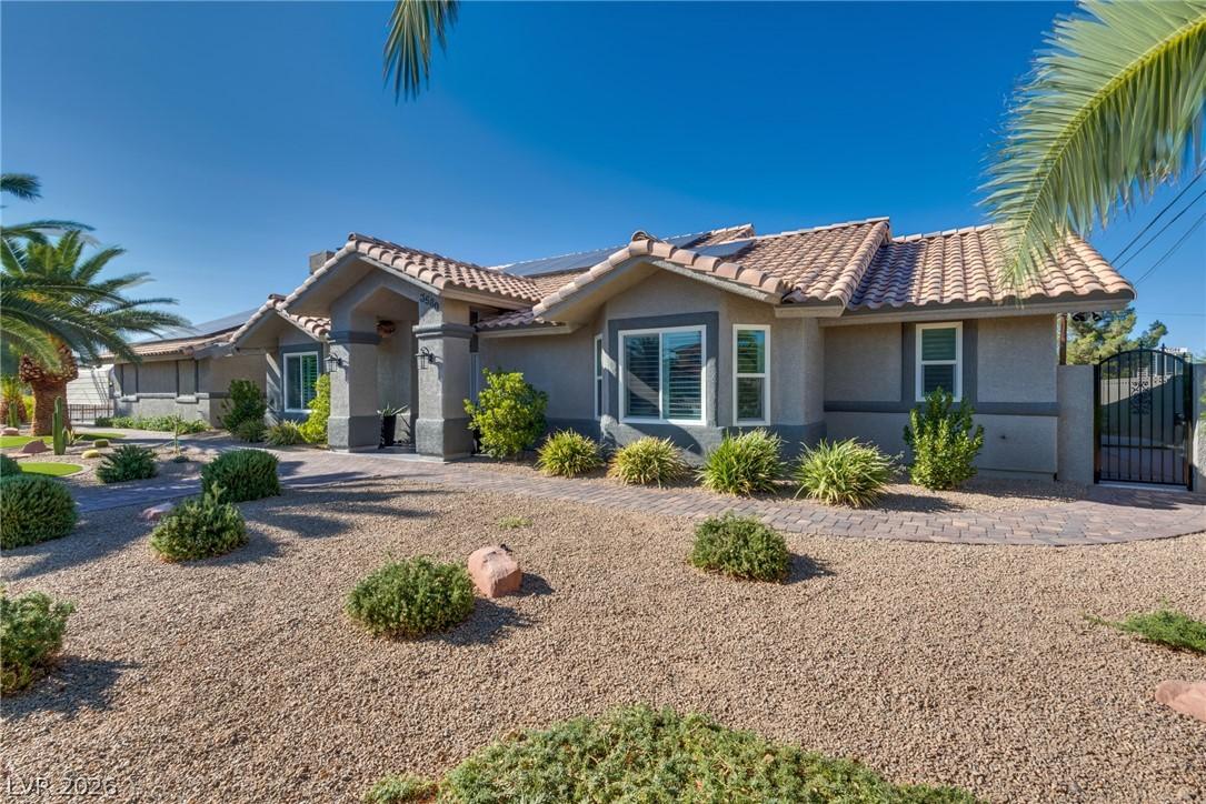 Image 2: This desert-landscaped residence features a charmi