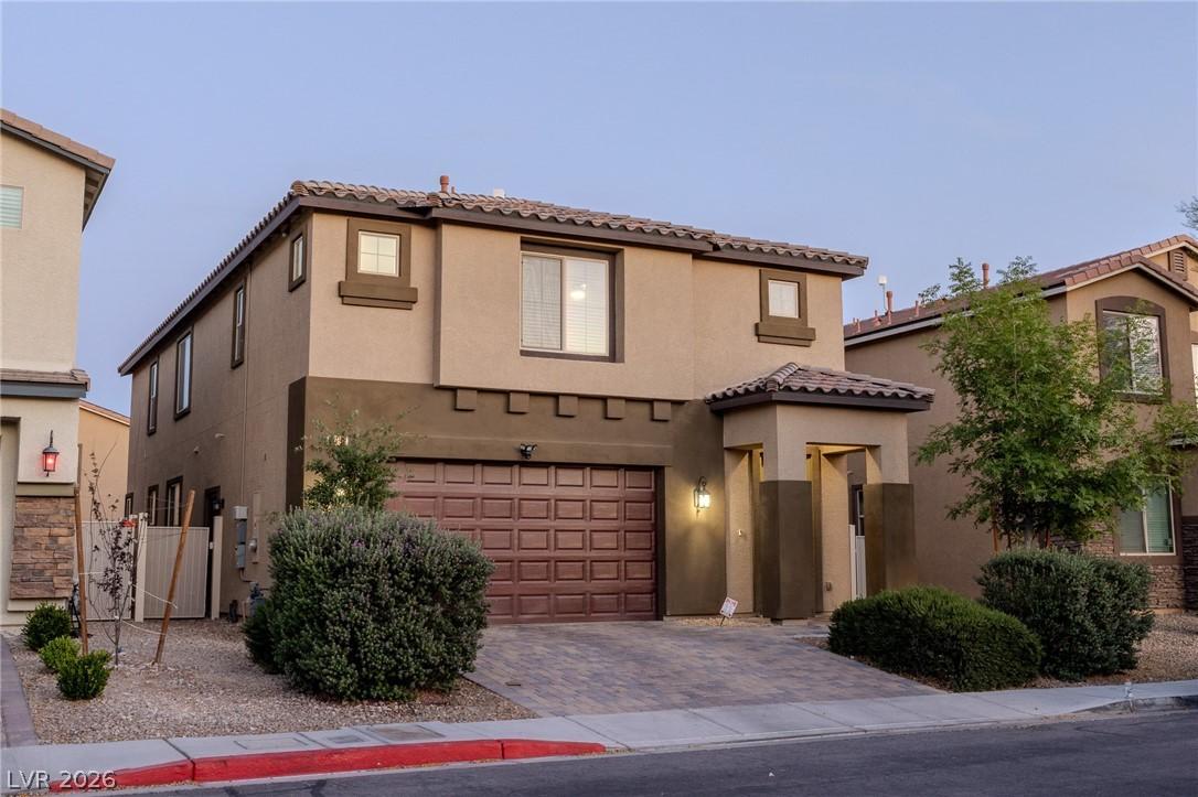Image 2: This modern home features a charming exterior with